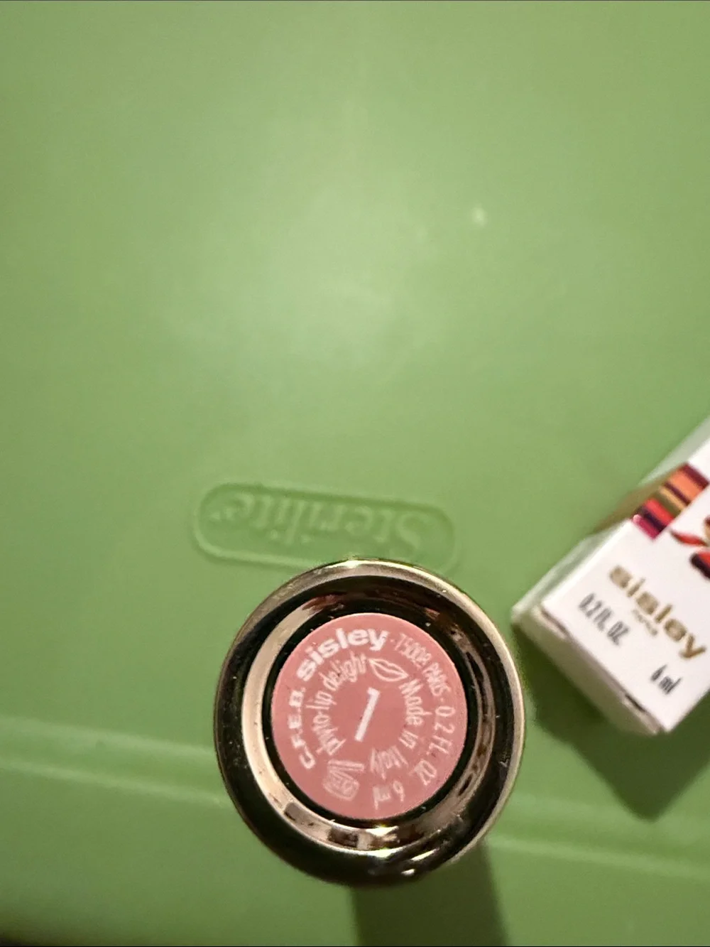 Lip product on green surface